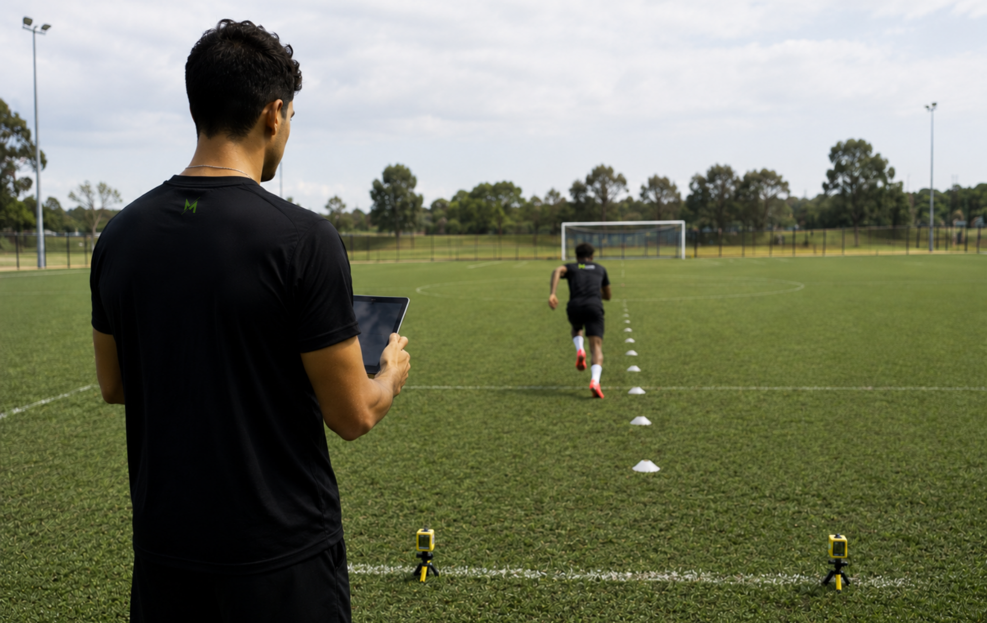 Young athletes sprinting through cone drills during a Movement Mechanics testing and training session